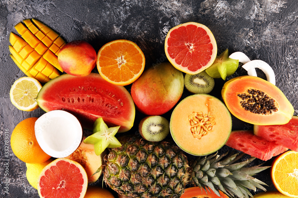 Tropical fruits background, many colorful ripe fresh tropical exotic fruits Tropical fruits background, many colorful ripe fresh tropical exotic fruits