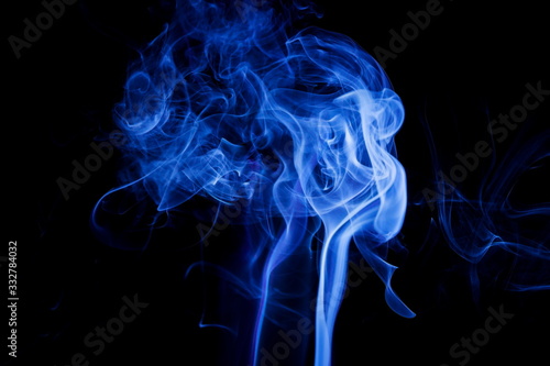 Blue smoke on black background