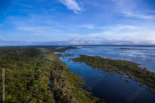 Aerial view of the river and the Amazon rainforest.
