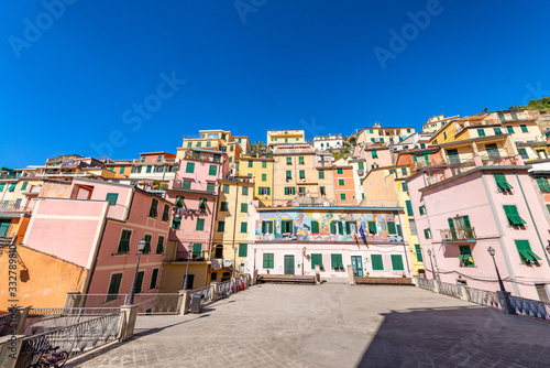 RIOMAGGIORE, ITALY - OCTOBER 2014: Colorful homes on a sunny day