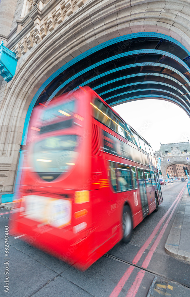 Red Bus speeds up along city streets in London, UK.