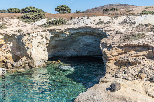 Cave, cliffs and rocks in Agios Konstantinos beach photo