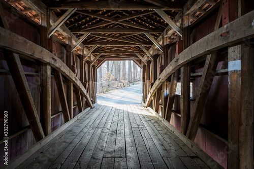 Looking down the inside of a covered wooden bridge in rural Lancaster County, Pennsylvania, USA. photo