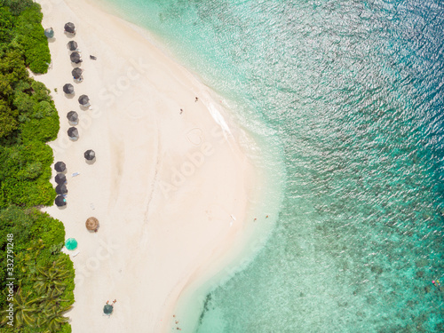 Fototapeta Naklejka Na Ścianę i Meble -  Aerial drone view of picture perfect beach and turquoise lagoon on small tropical island on Maldives.