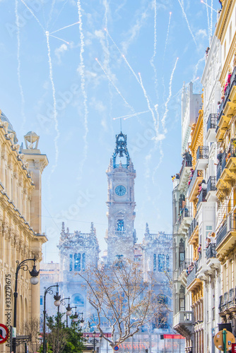 Valencia, Spain - March 19, 2019: Fireworks fired in a Mascleta Fallas during the day photo