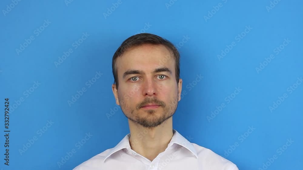 front view on man face in center, remove medical mask, finish of virus coronavirus epidemic or pollution quarantine, blue background front view on man face in center, remove medical mask, finish of virus coronavirus epidemic or pollution quarantine, blue background