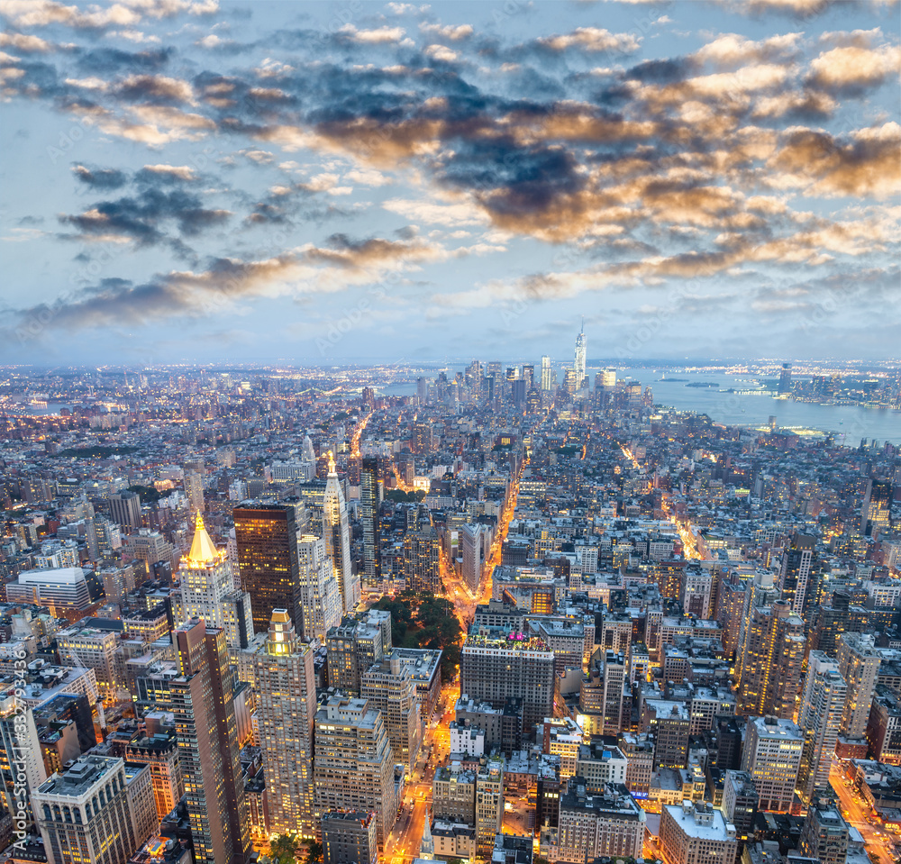 Manhattan skyscrapers at sunset, aerial view of New York City