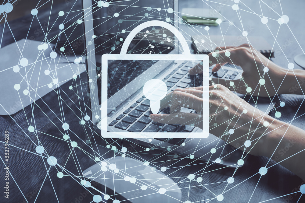 Double exposure of woman hands working on computer and lock hologram drawing. Security concept. Double exposure of woman hands working on computer and lock hologram drawing. Security concept.