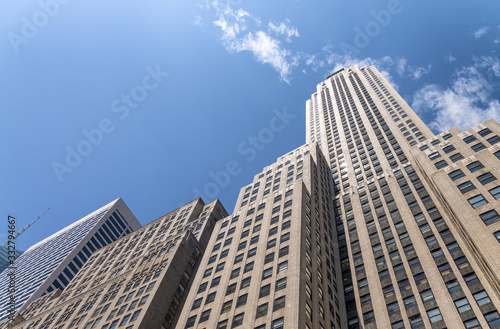 Skyscrapers of Manhattan, giant wall with blue sky