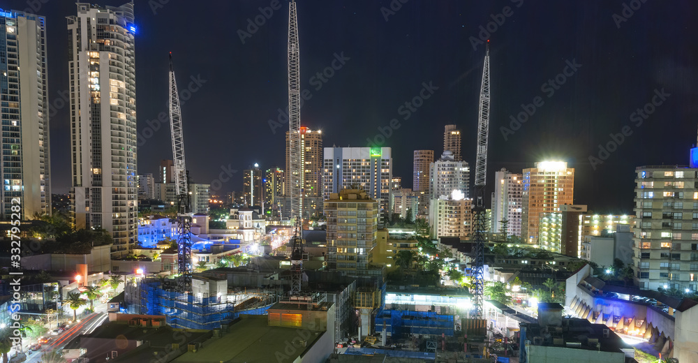 Fototapeta premium Surfers Paradise, Gold Coast. City skyscrapers and buildings at night, aerial view, Australia
