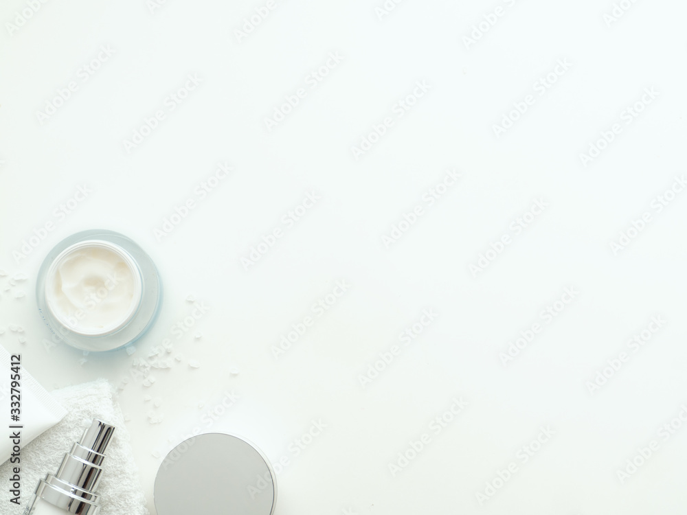 Organic cosmetic products bottles with salt around it Organic cosmetic products bottles with salt around it