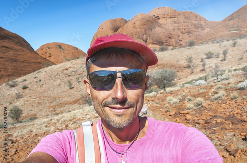 Man wearing red hat against the hot in the australian outback