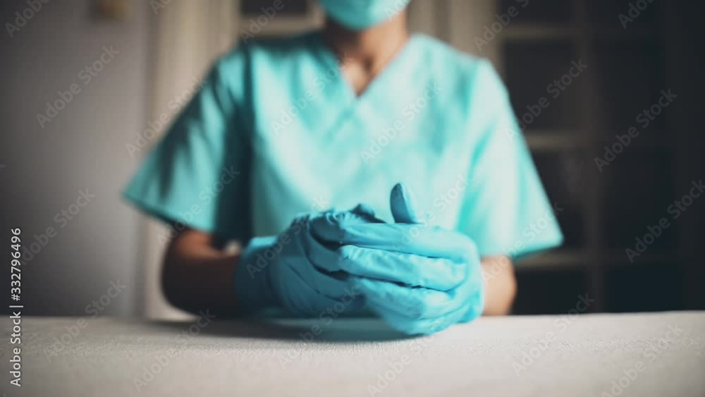 Conceptual video of a doctor putting on the gloves.