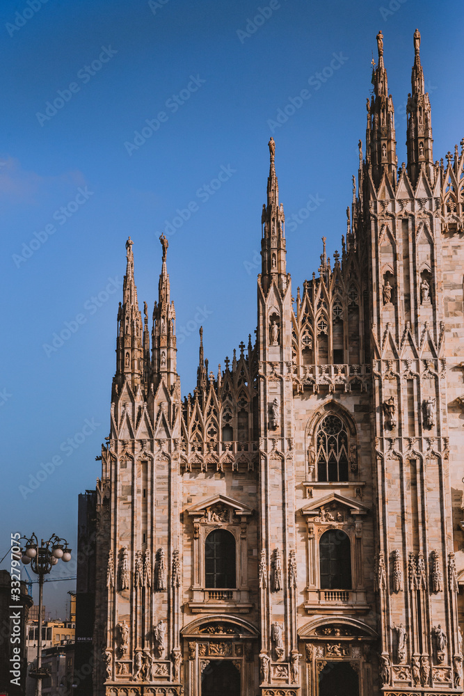 Piazza Del Duomo, Milano, Italy - a view from Milano Cathedral over beautiful sunset and place full of tourists