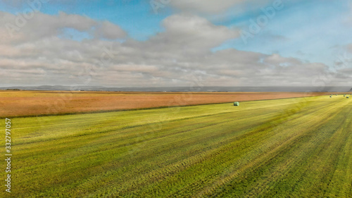 Fototapeta Naklejka Na Ścianę i Meble -  Aerial view of iceland meadows with hay bales in summer season