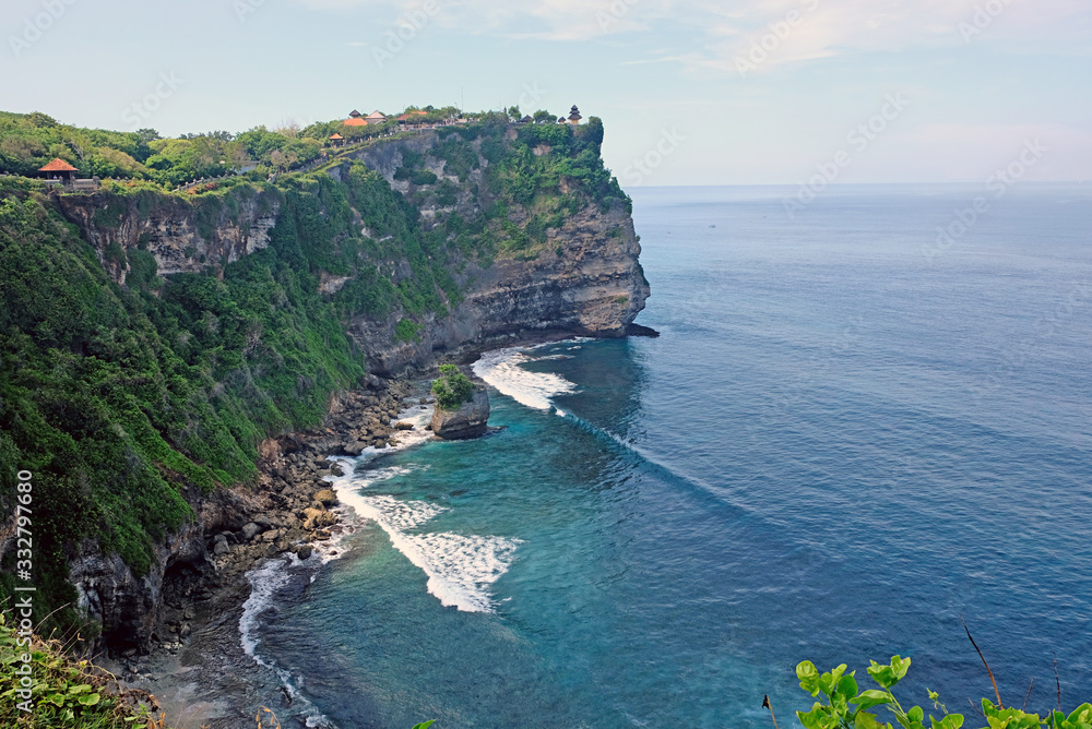 Uluwatu temple is a famous hindu temple in Bali. Uluwatu is one of Bali's picture postcard temples, whose cliff base is also known among surfers as an exotic surf spot.