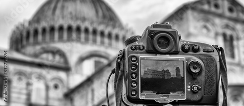 Modern Camera immortalizing Leaning Tower of Pisa photo