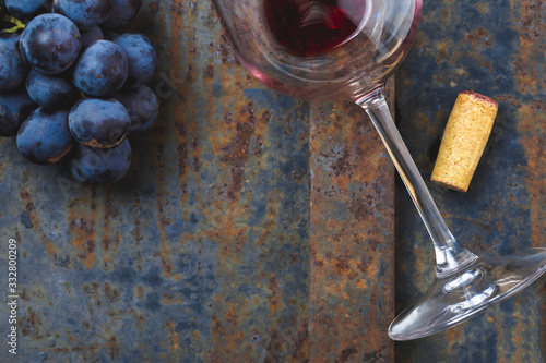 Wine concept - wine, grape on rustik dark background. Top wiew