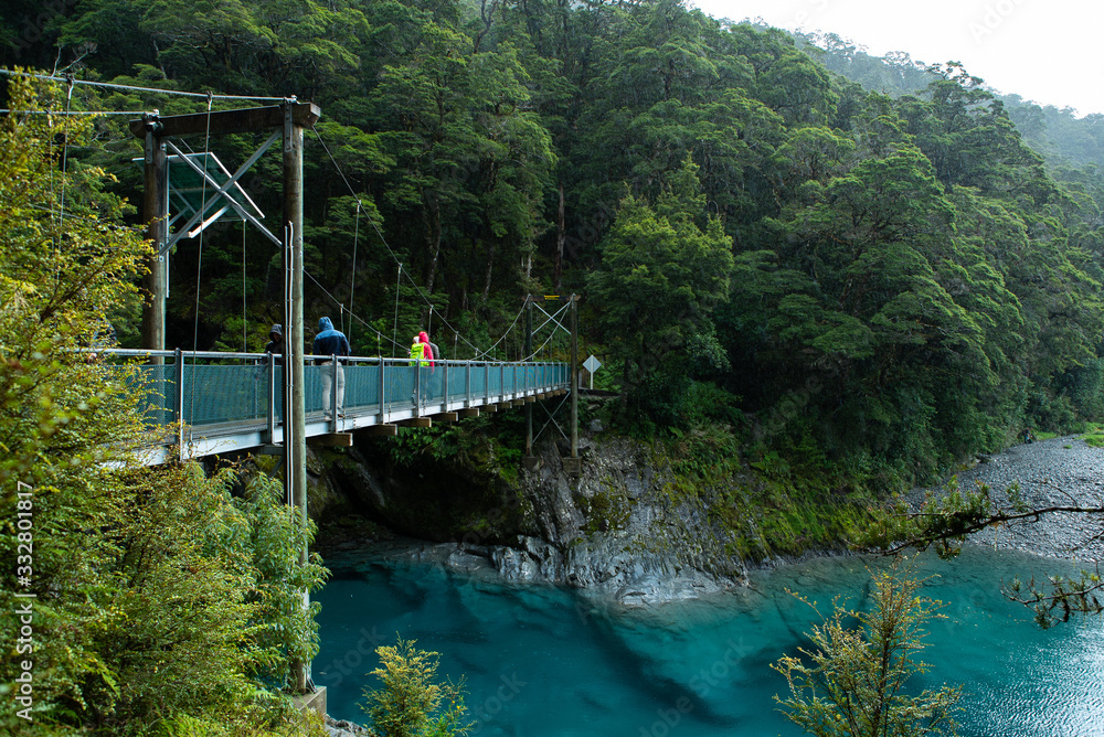 Fototapeta premium Bridge over river at blue pools track in New Zealand