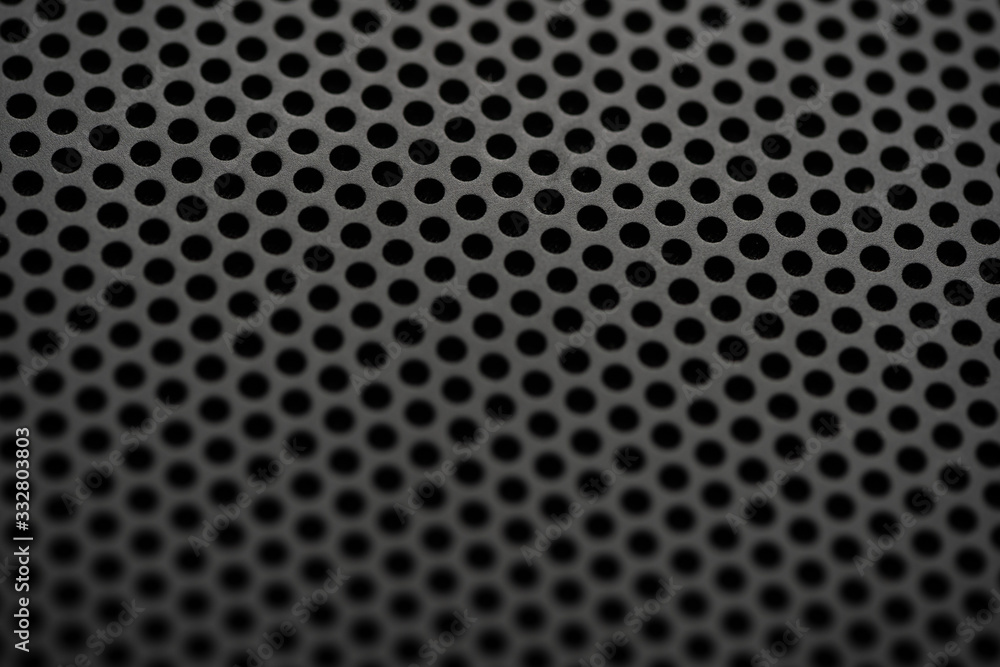 Black metal texture with round holes. Industrial background. Black metal texture with round holes. Industrial background.
