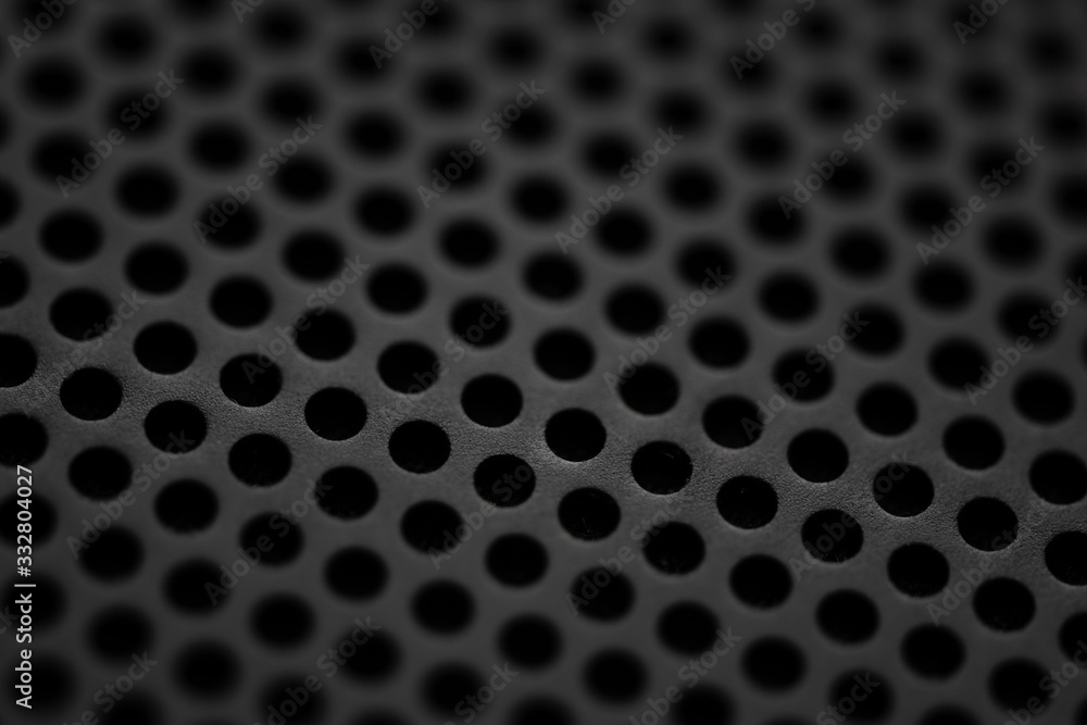Black metal texture with round holes. Industrial background. Black metal texture with round holes. Industrial background.