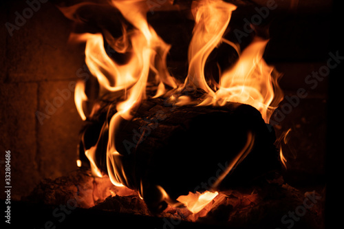 Burning wood in fire place.