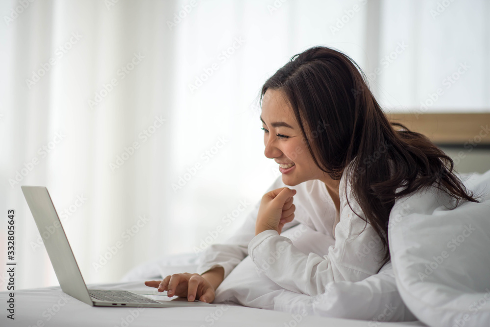 Asian woman use notebook work from home Asian woman use notebook work from home