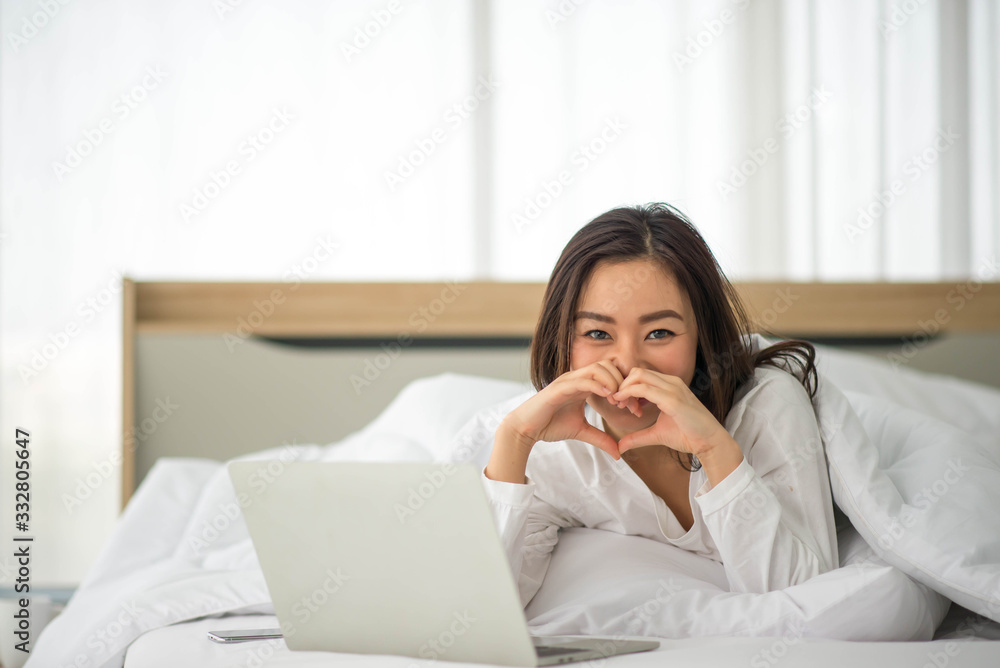 Asian woman use notebook work from home Asian woman use notebook work from home
