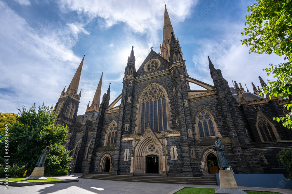 Obraz premium St Patrick's Cathedral. Spire a Roman Catholic Cathedral church with blue sky at Eastern hill in Melbourne, Victoria, Australia