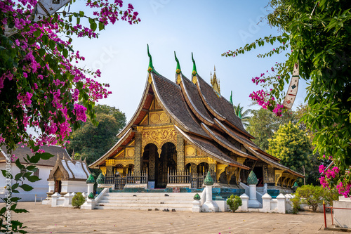 Wat Xieng Thong temple with blue sky, Luang Prabang, Laos photo