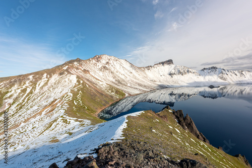 Tolbachik volcano reflection in the quiet mountain lake  Kamchatka