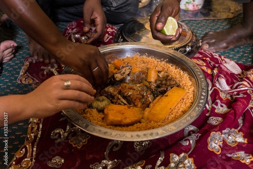 People Eating Traditional Mauritanian Meal with Hands