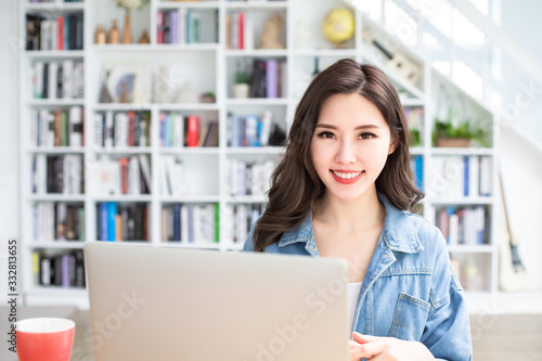 student using laptop at home