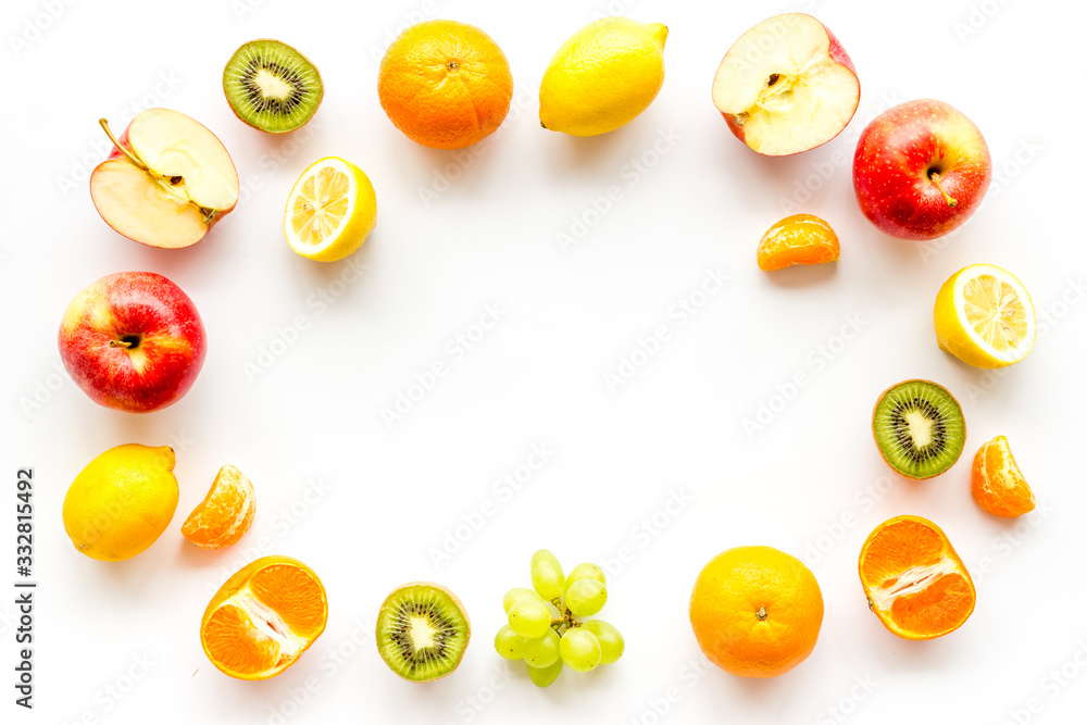 Colorful fruit mockup. Cut apple, kiwi, citrus on white background top-down copy space Colorful fruit mockup. Cut apple, kiwi, citrus on white background top-down copy space
