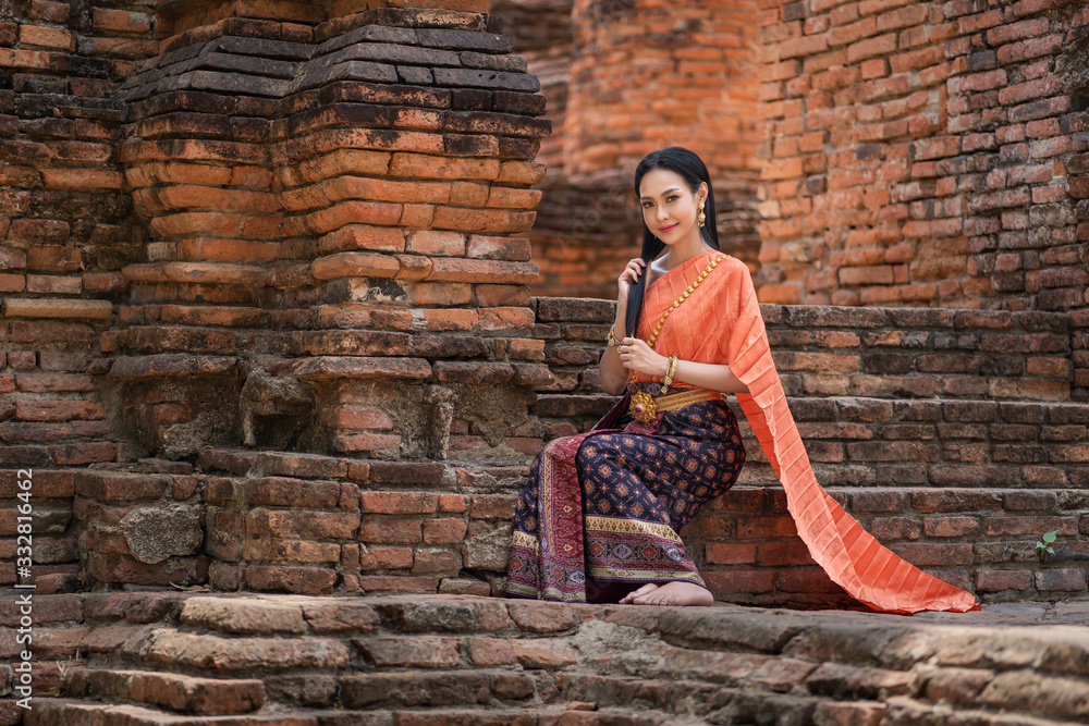 Asian women wearing in Thai dress costume traditional according Thai culture and tradition at Ayutthaya, Thailand