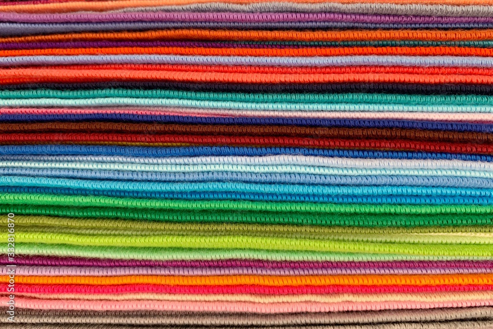 Beautifully multi-colored fabrics stacked together