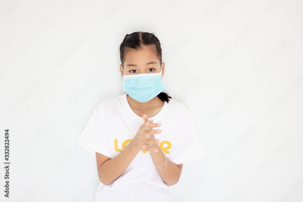Children girl is protective surgical mask on their face and prevent Air pollution pm2.5 concept and Coronavirus Covid-19. Children girl is protective surgical mask on their face and prevent Air pollution pm2.5 concept and Coronavirus Covid-19.