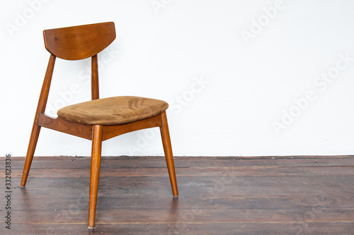 Vintage wooden chair on on wooden parquet floor.