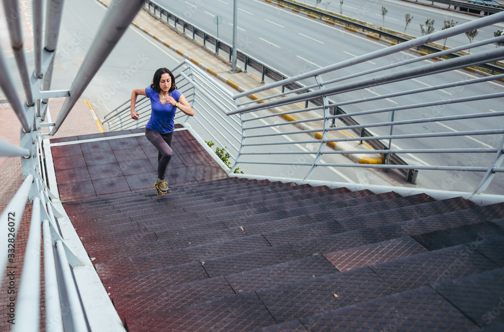 A woman runs up the stairs.