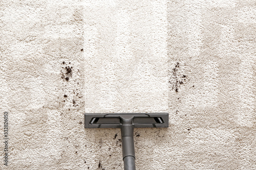 Obraz na plátně Hoovering of carpet with vacuum cleaner, top view