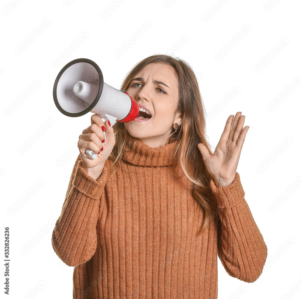 Emotional young woman with megaphone on white background Emotional young woman with megaphone on white background