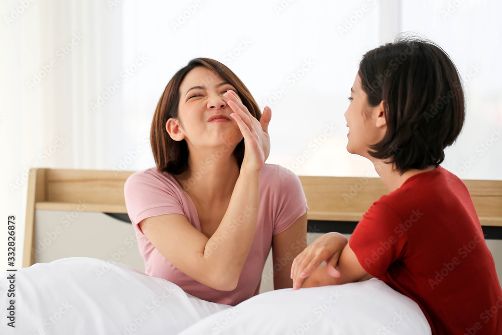 Happy Couple asia woman bored with bad breath in bedroom morning. Happy Couple asia woman bored with bad breath in bedroom morning.