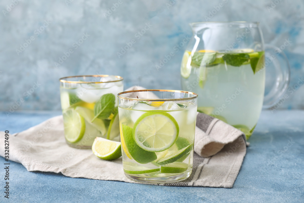 Glassware of fresh lime lemonade on table Glassware of fresh lime lemonade on table