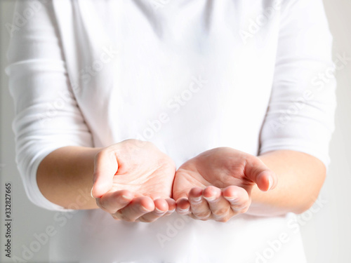 Close-up of a woman opening her palms that symbol of giving or donating.