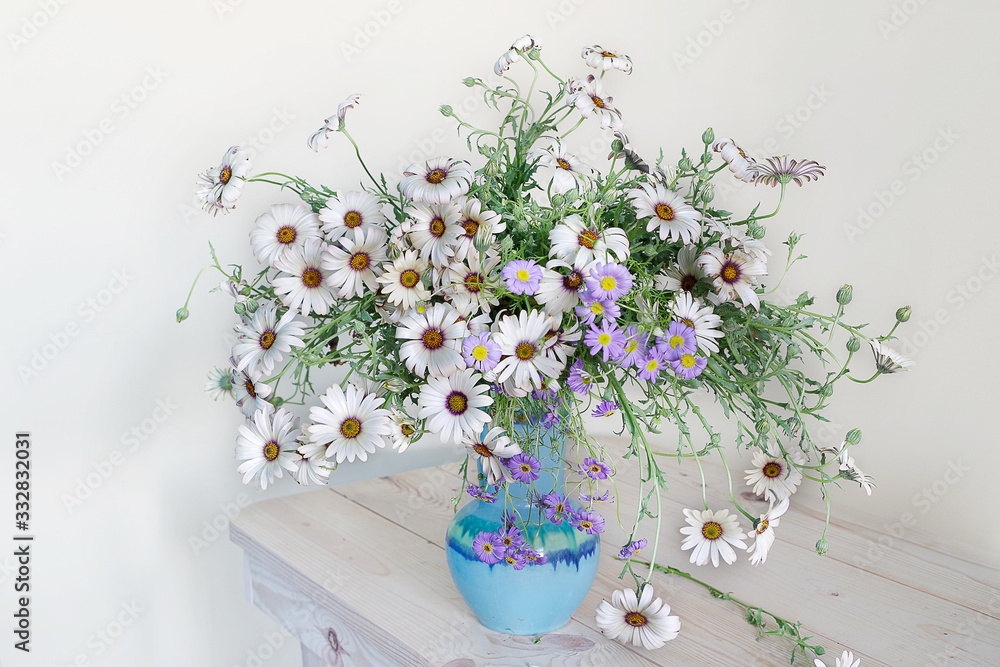 Still life with white daisies and ripe berries