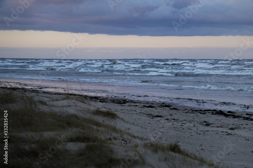 Fototapeta Naklejka Na Ścianę i Meble -  Thunderclouds over the white waves of the Gulf of Riga.