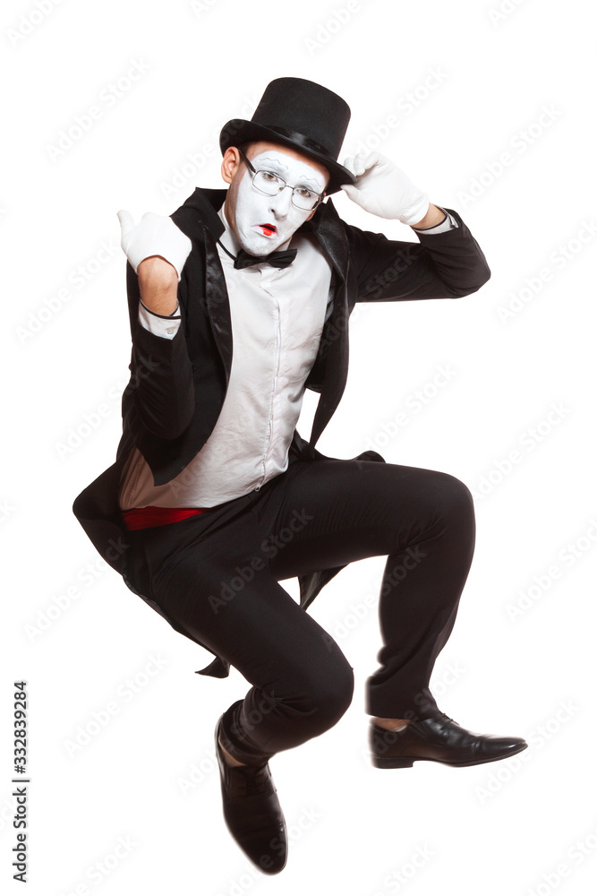 Portrait of a male mime artist performing, isolated on white background. Symbol of unpleasantly surprised, upset, falling, squatting, sad Portrait of a male mime artist performing, isolated on white background. Symbol of unpleasantly surprised, upset, falling, squatting, sad