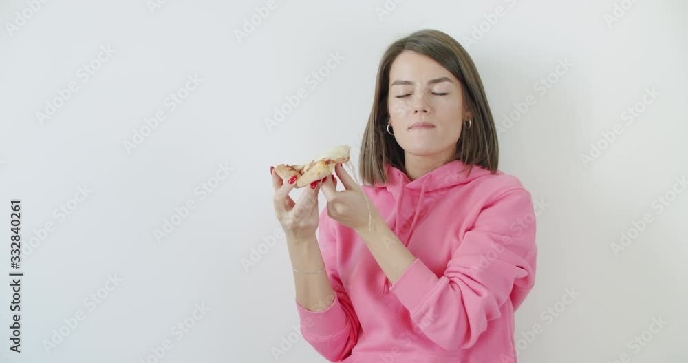 young woman eating pizza young woman eating pizza