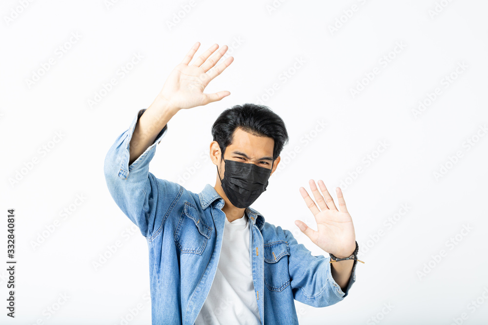 Asian young man with light hair in a medical protective mask, Stop the Covid 19 Coronavirus Wuhan Sars illness. Coronavirus and Air pollution pm2.5 concept. Asian young man with light hair in a medical protective mask, Stop the Covid 19 Coronavirus Wuhan Sars illness. Coronavirus and Air pollution pm2.5 concept.
