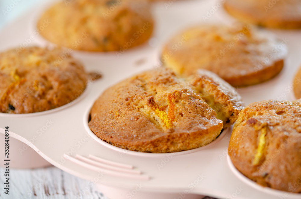 Delicious muffin with orange on a wooden table. Delicious muffin with orange on a wooden table.